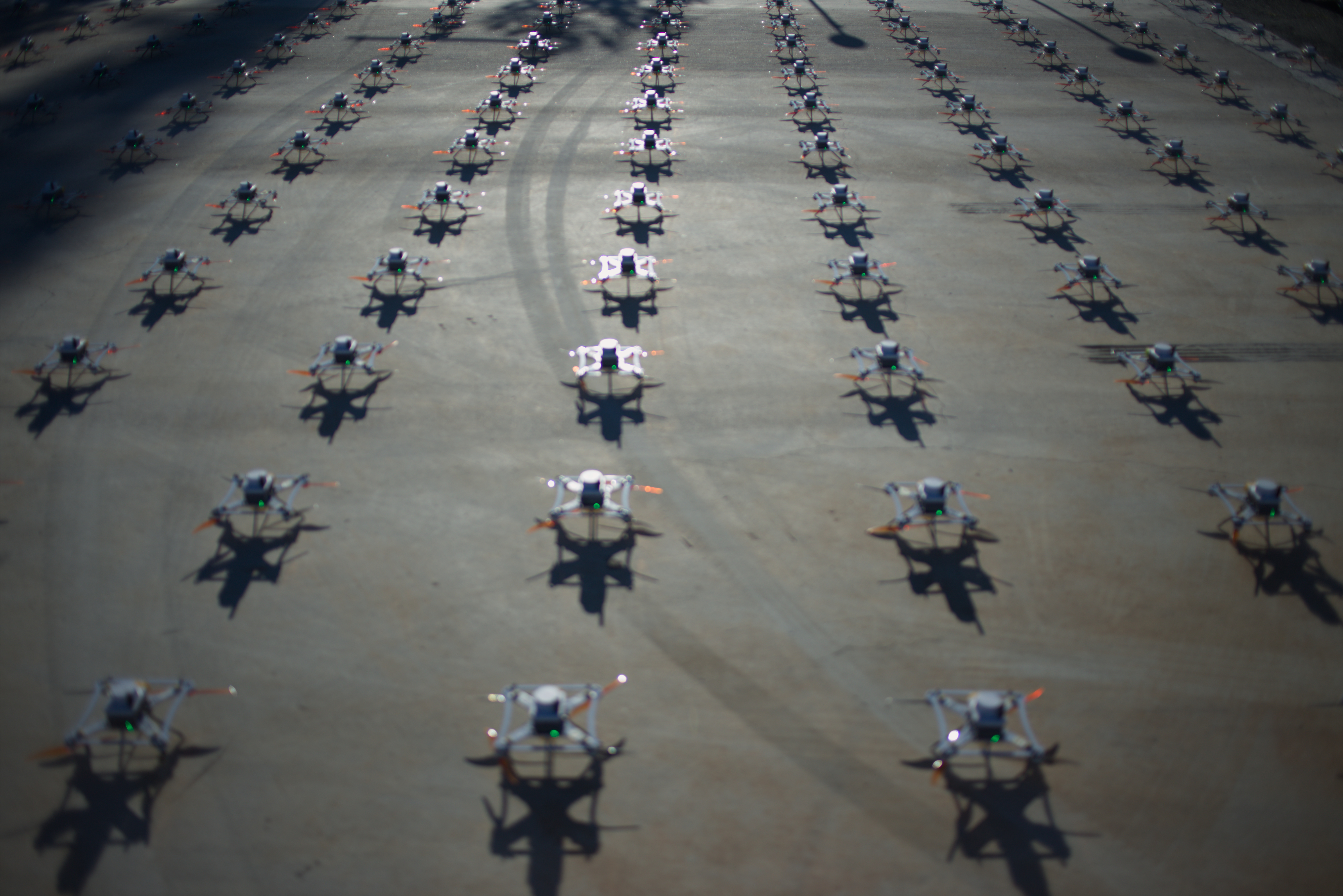 Aerial view of the LuminousBee drone fleet in formation