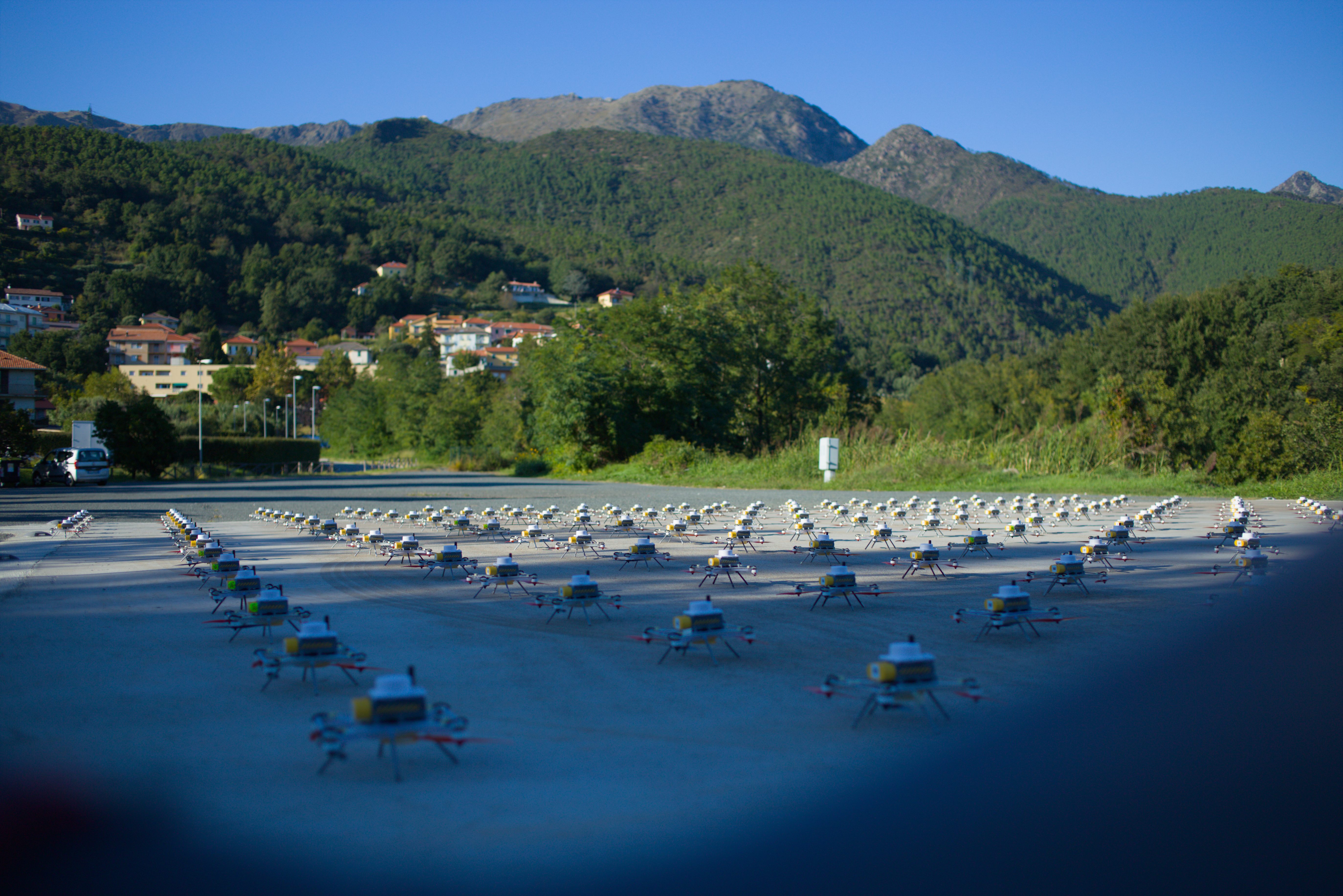 LuminousBee fleet with Italian mountains in background