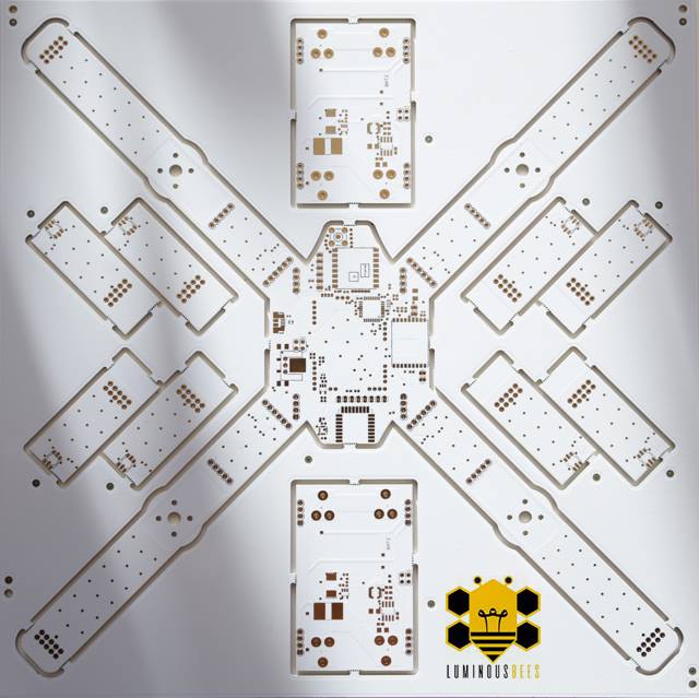 LuminousBee PCB design — the signature X-shape with integrated LED panels